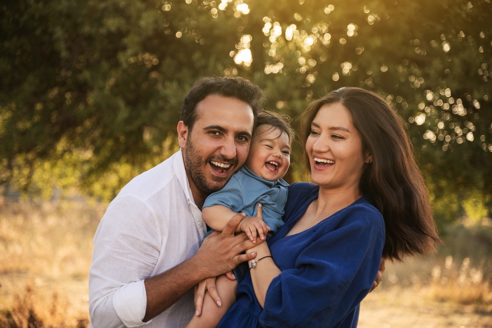 Family laughing together outdoors